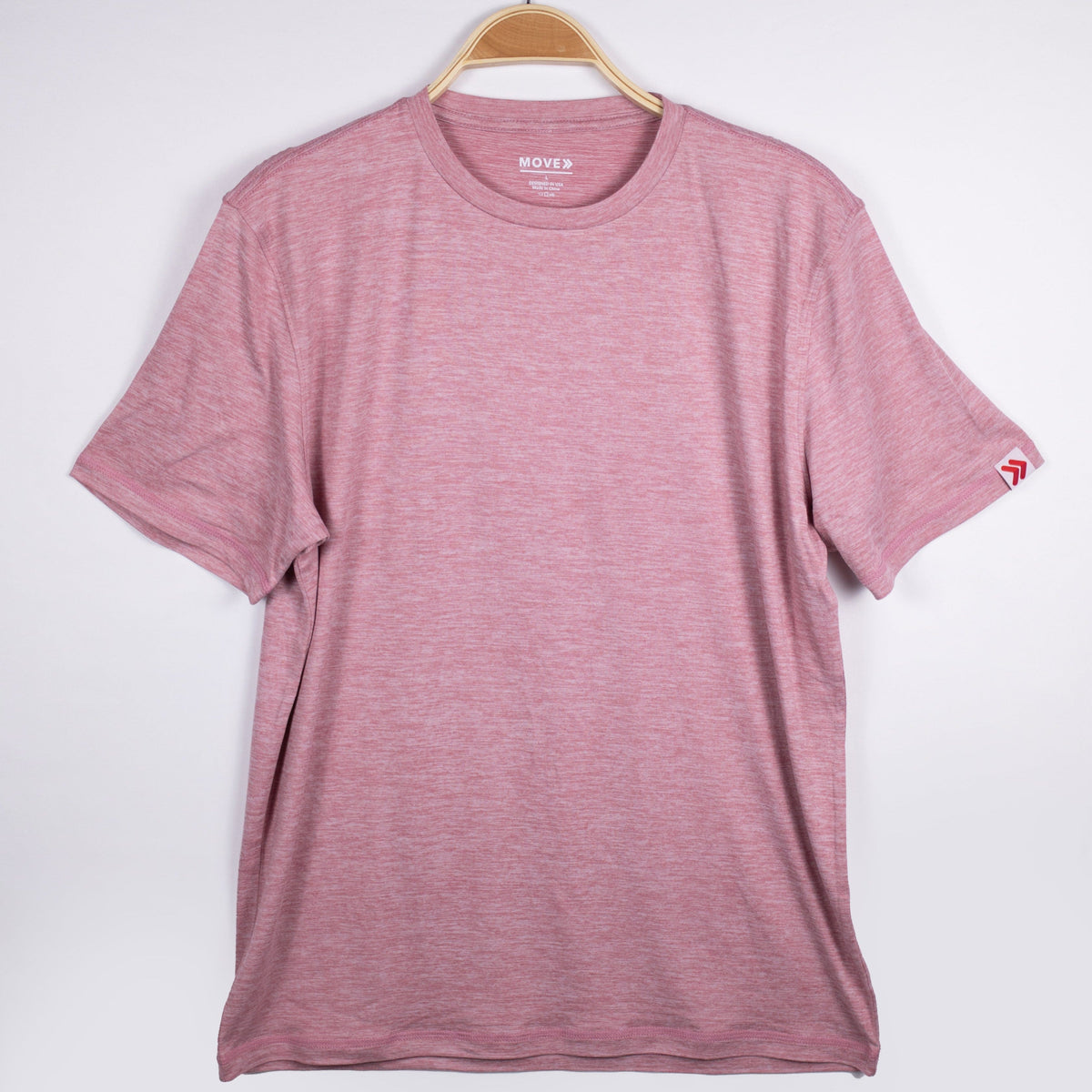 MOVE Sport Apparel men’s Essential Short Sleeve: Heather Crimson shirt shown from the front on a hanger.