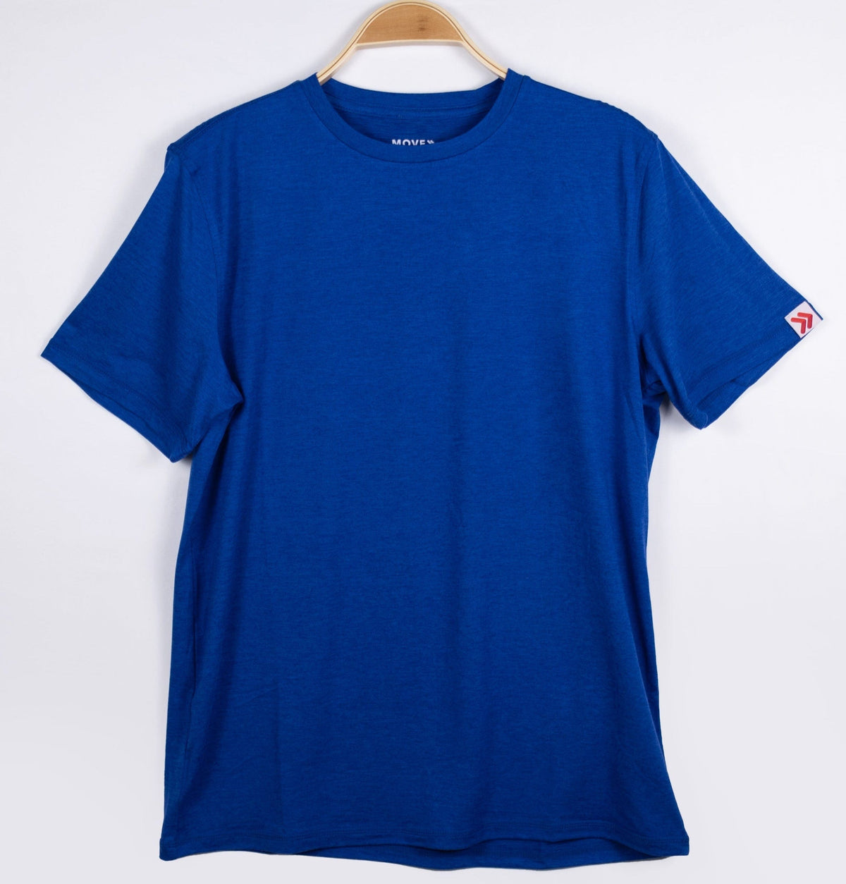 MOVE Sport Apparel men’s Essential Short Sleeve: Surf the Web blue shirt shown from the front on a hanger.