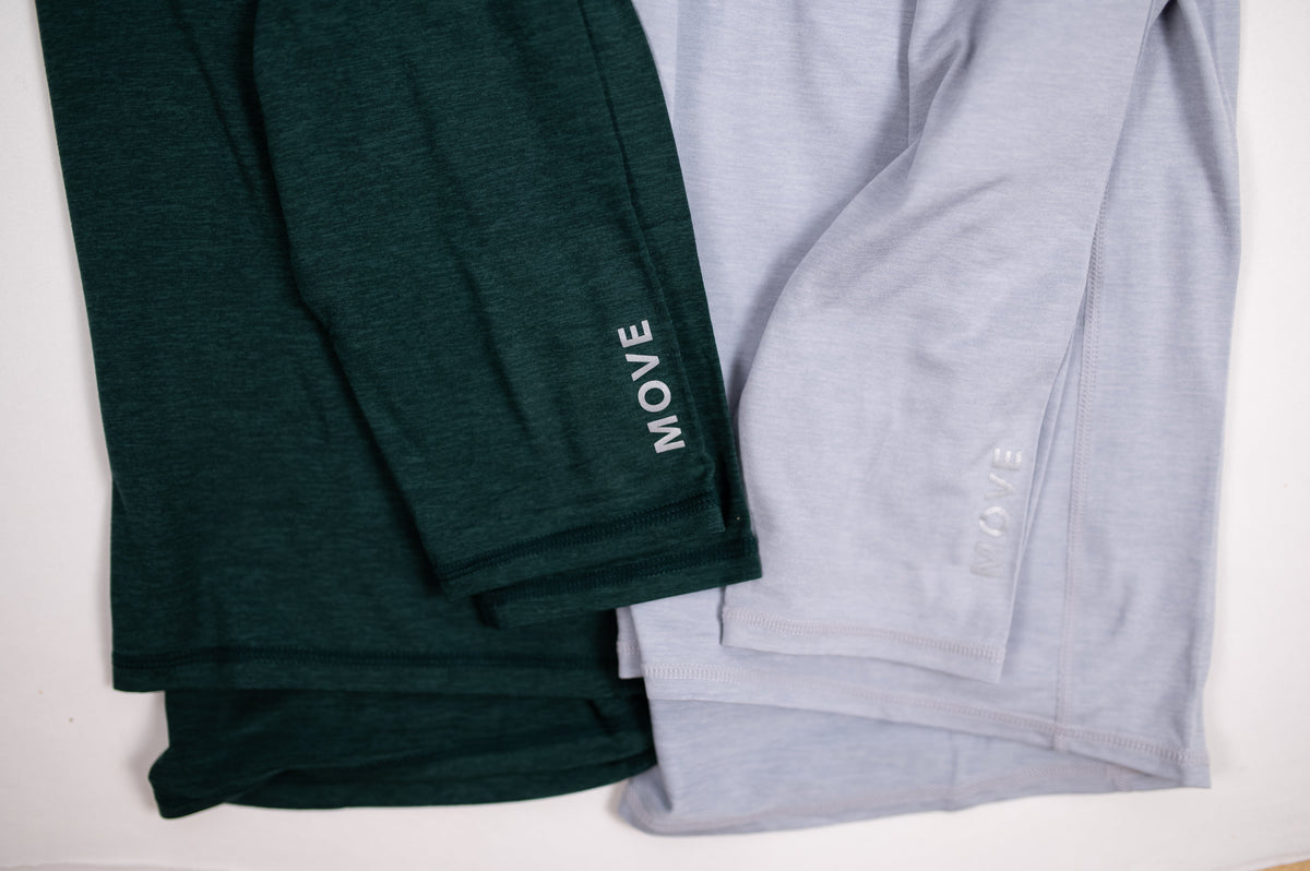 Cuff comparison of MOVE Sport Apparel Men’s Essential Quarter Zip in Pine Grove and Silver Cloud.