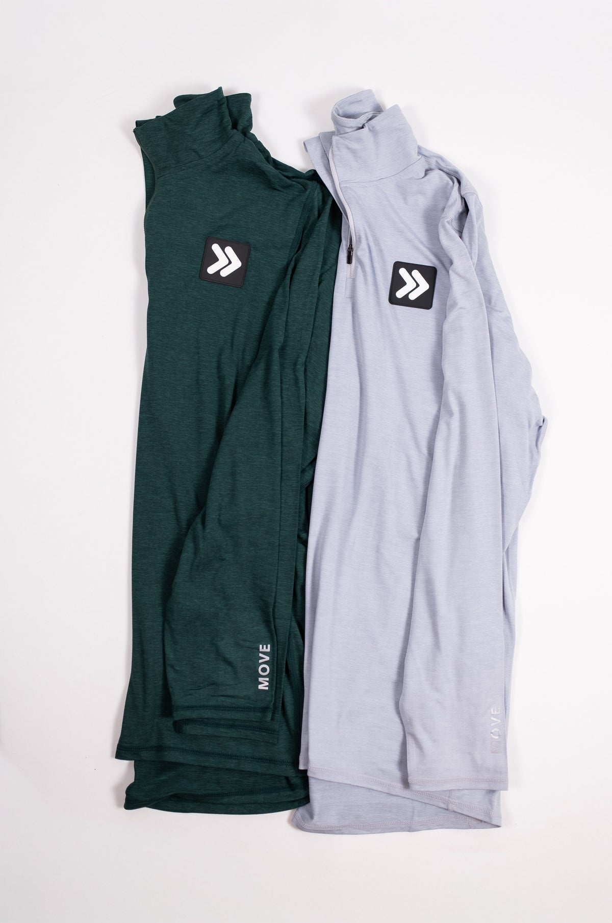 MOVE Sport Apparel Men’s Essential Quarter Zip in Pine Grove and Silver Cloud arranged side by side.