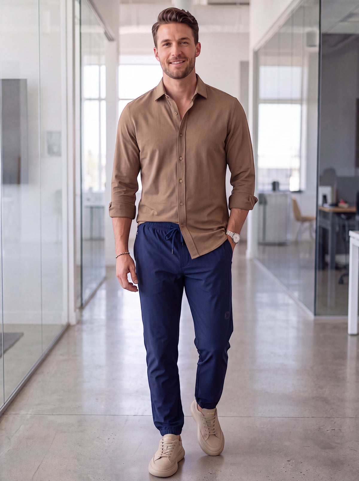 MOVE sport apparel men's navy blue ripstop 5-pocket joggers worn by a man in an office setting.