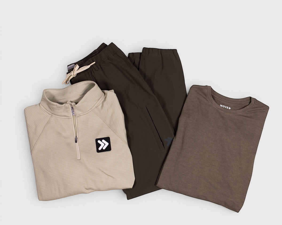 MOVE sport apparel set featuring dark brown ripstop joggers, a beige quarter-zip pullover, and a brown t-shirt.