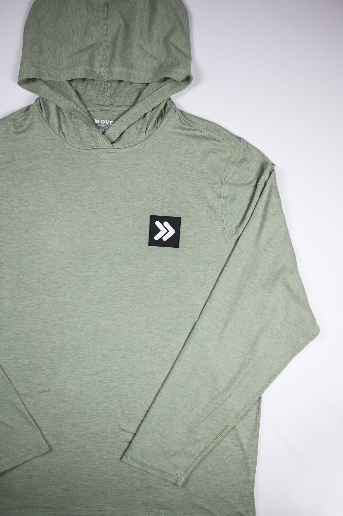 Seagrass hoodie front showing hood, long sleeves and original dark square with white double chevrons on the left chest.