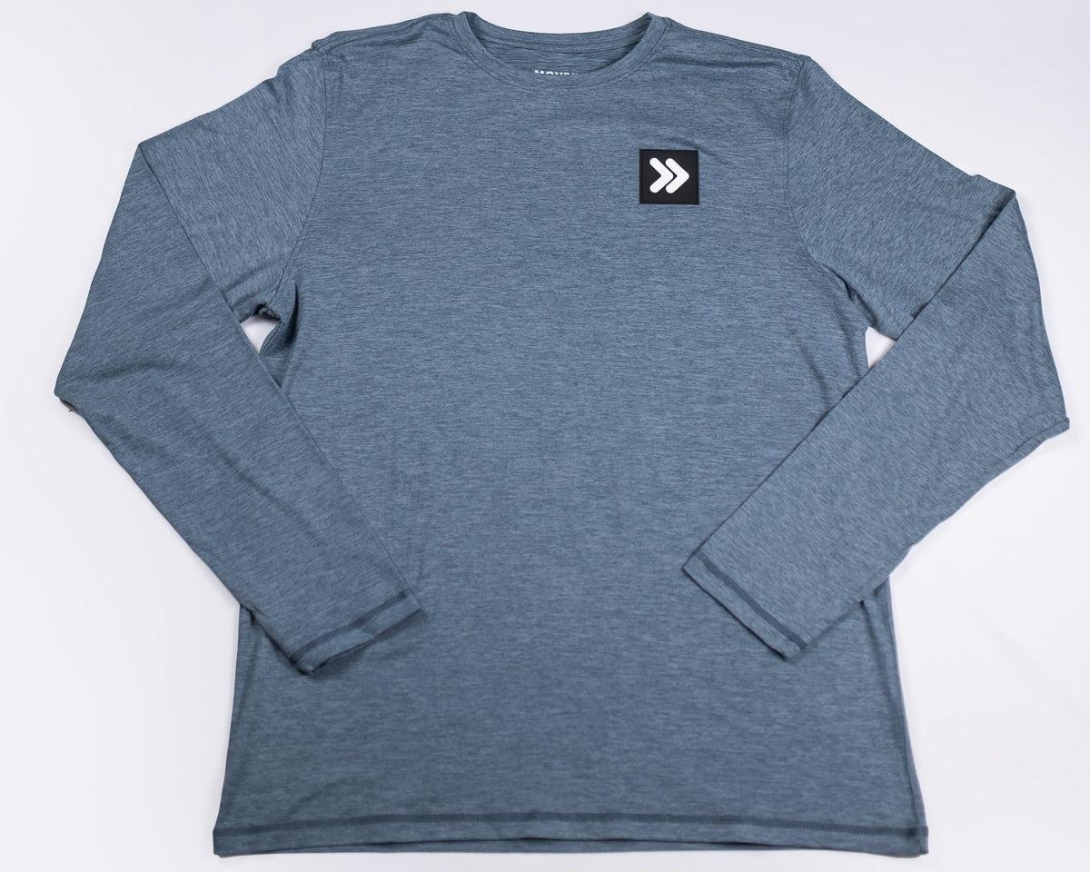 Front view of MOVE Sport Apparel men’s Essential BLACK LABEL Special Edition Long Sleeve in Blue Mirage with original black-and-white chest embellishment.
