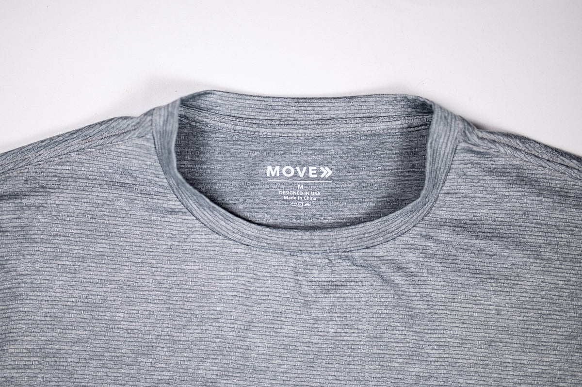 Ultimate Gray LuxDry tee crew neckline, interior label and fabric detail.