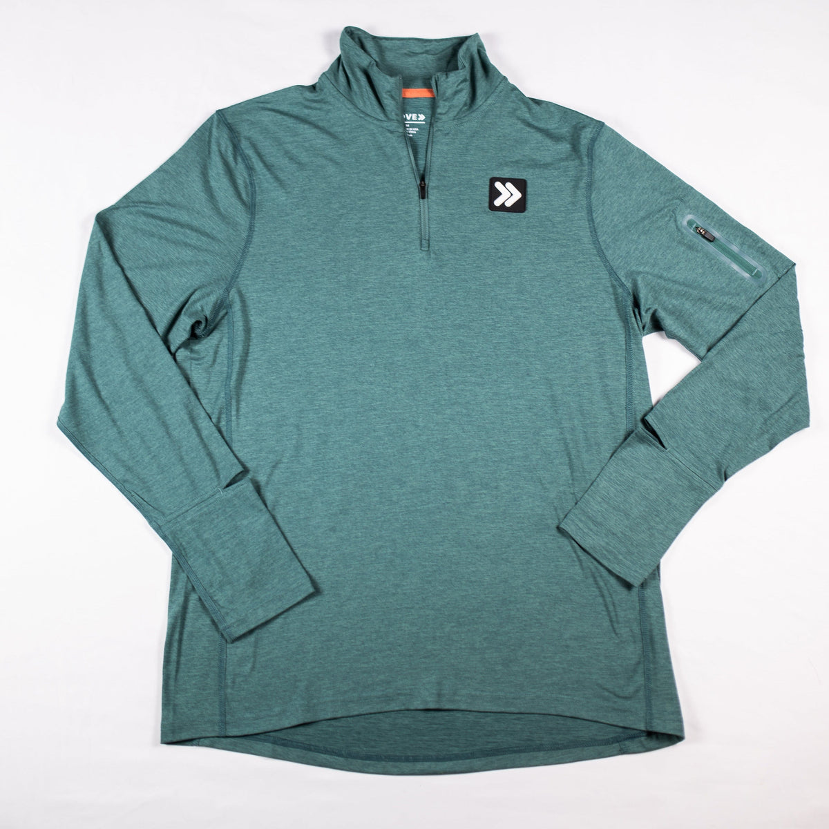 Front flat-lay view of the Heather North Atlantic MOVE Sport Apparel men’s Essential Quarter Zip Pro, showing the quarter zipper, chest patch and sleeve pocket.