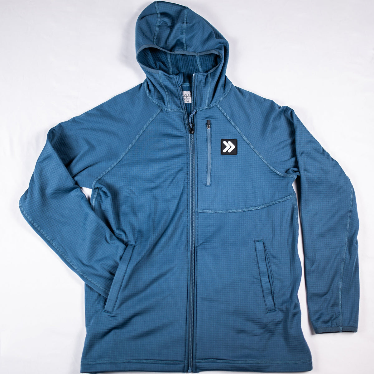 Front flat-lay view of the MOVE Sport Apparel men’s waffle hooded jacket in Blue Mirage, showing the hood, zipper, pockets and original chest patch.
