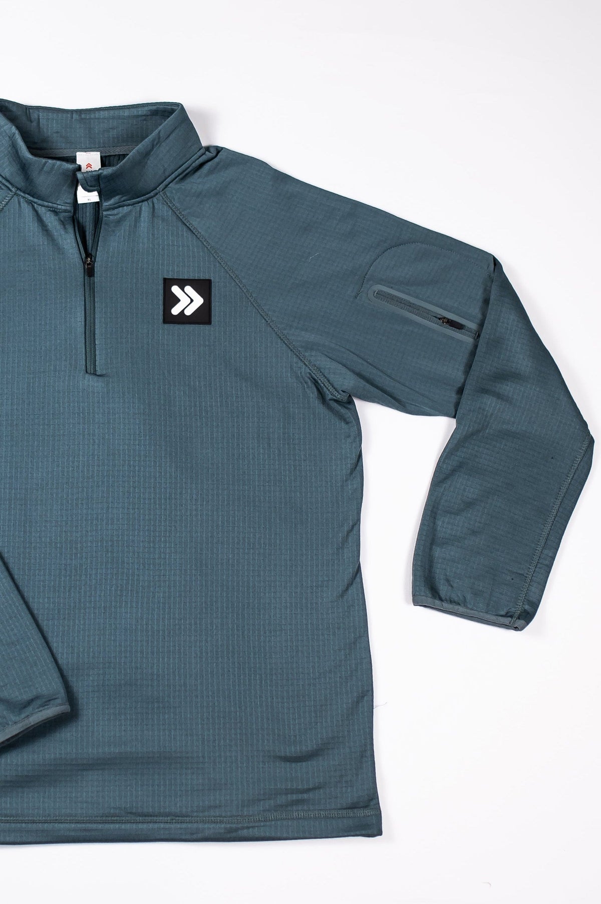 Front reference of the Balsam Green MOVE Sport Apparel men’s waffle quarter zip, showing its collar, quarter zipper, sleeve and original chest patch.