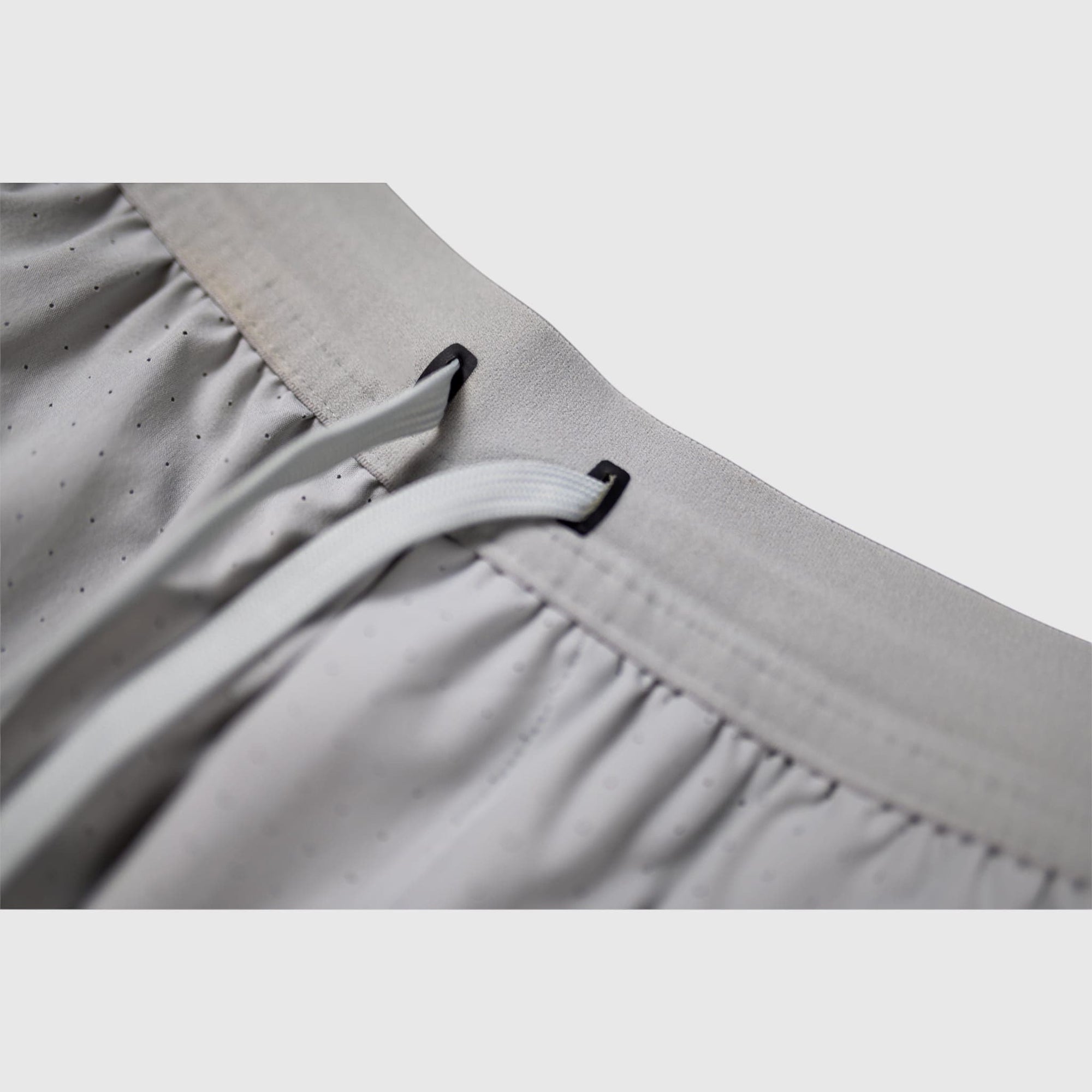 MOVE sport apparel Agility 6 inch training shorts in light grey with a drawstring waistband and perforated fabric