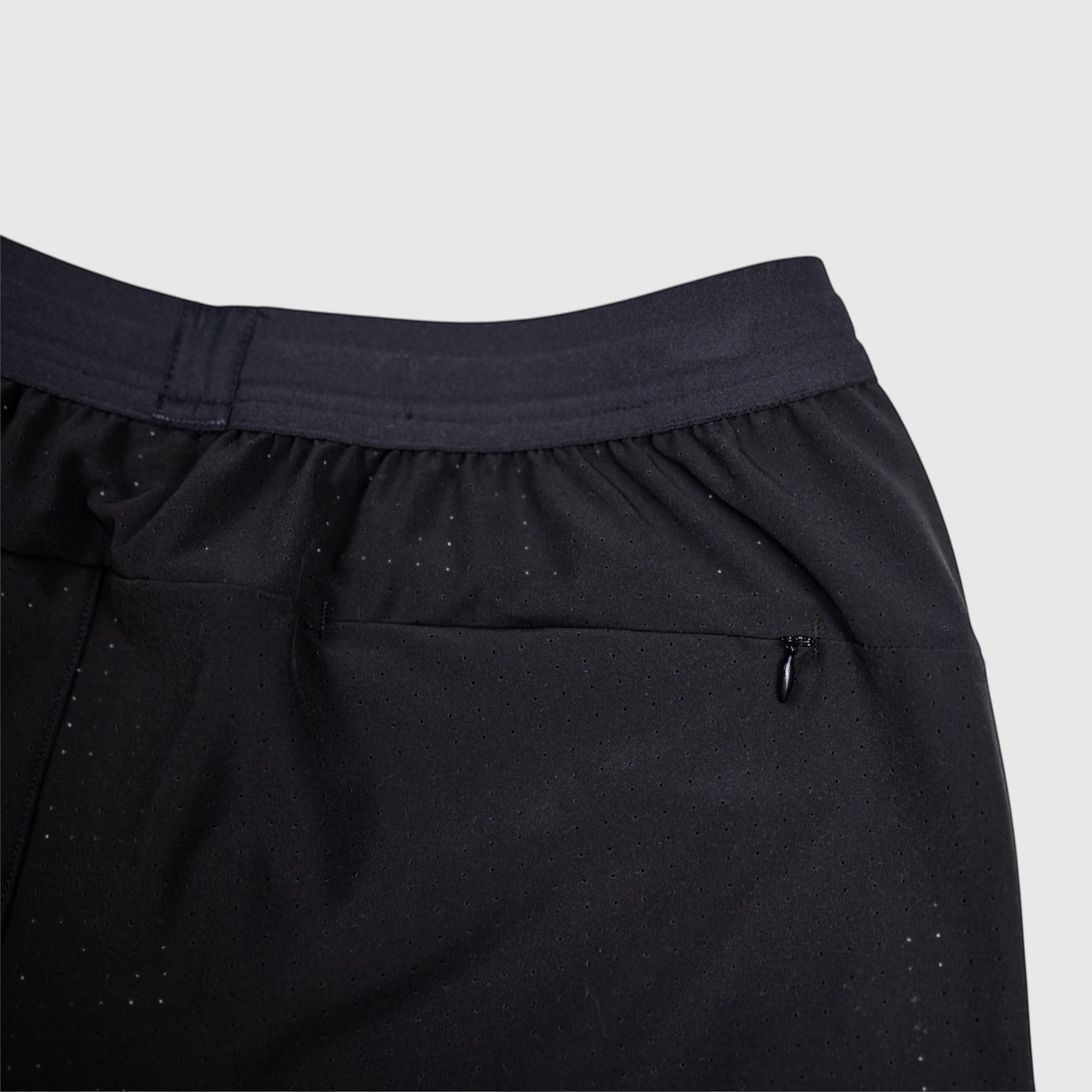 MOVE sport apparel black Agility 6 inch training shorts with a zippered back pocket and perforated fabric detail.
