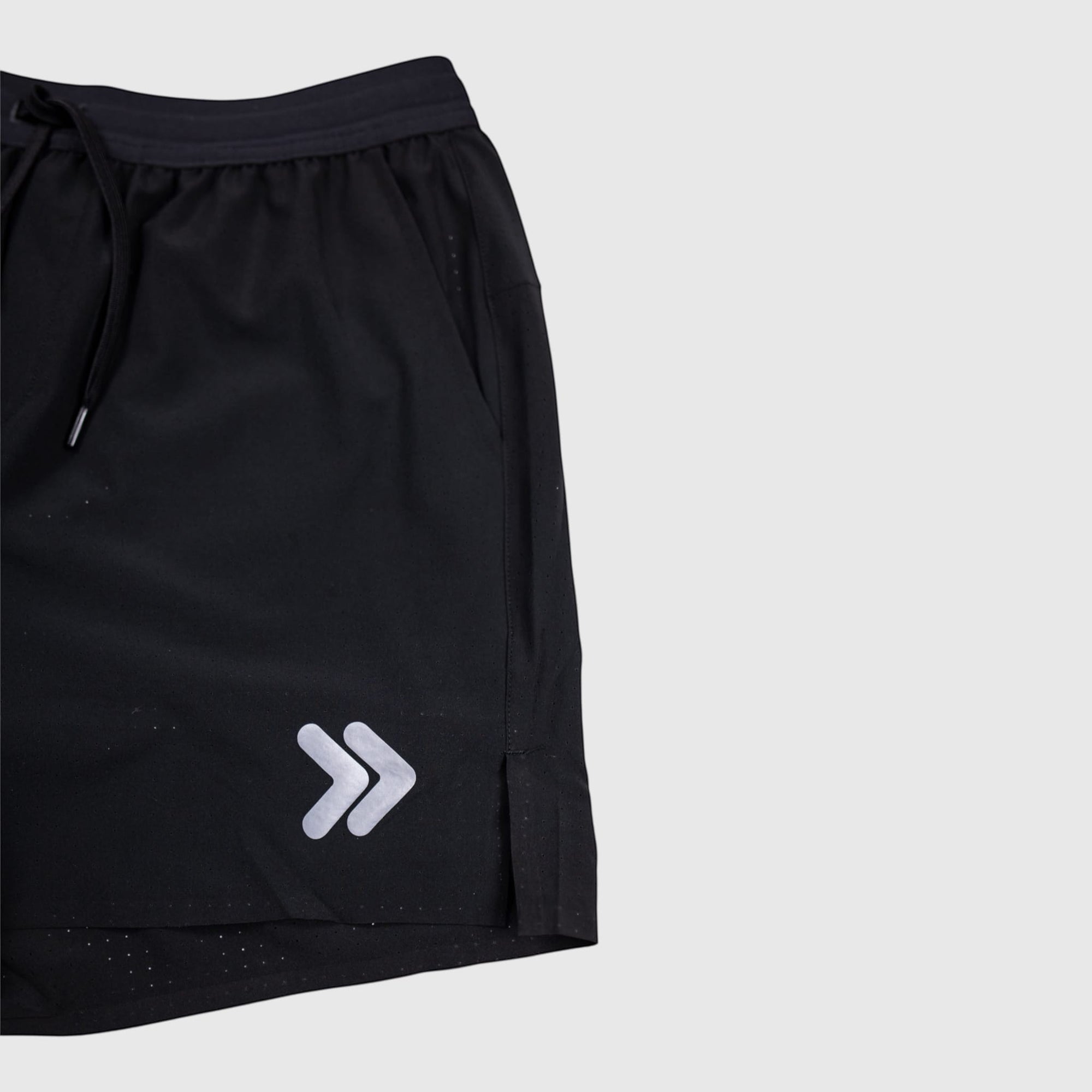 MOVE sport apparel black 6 inch agility training shorts with white chevron logo and side slit detail