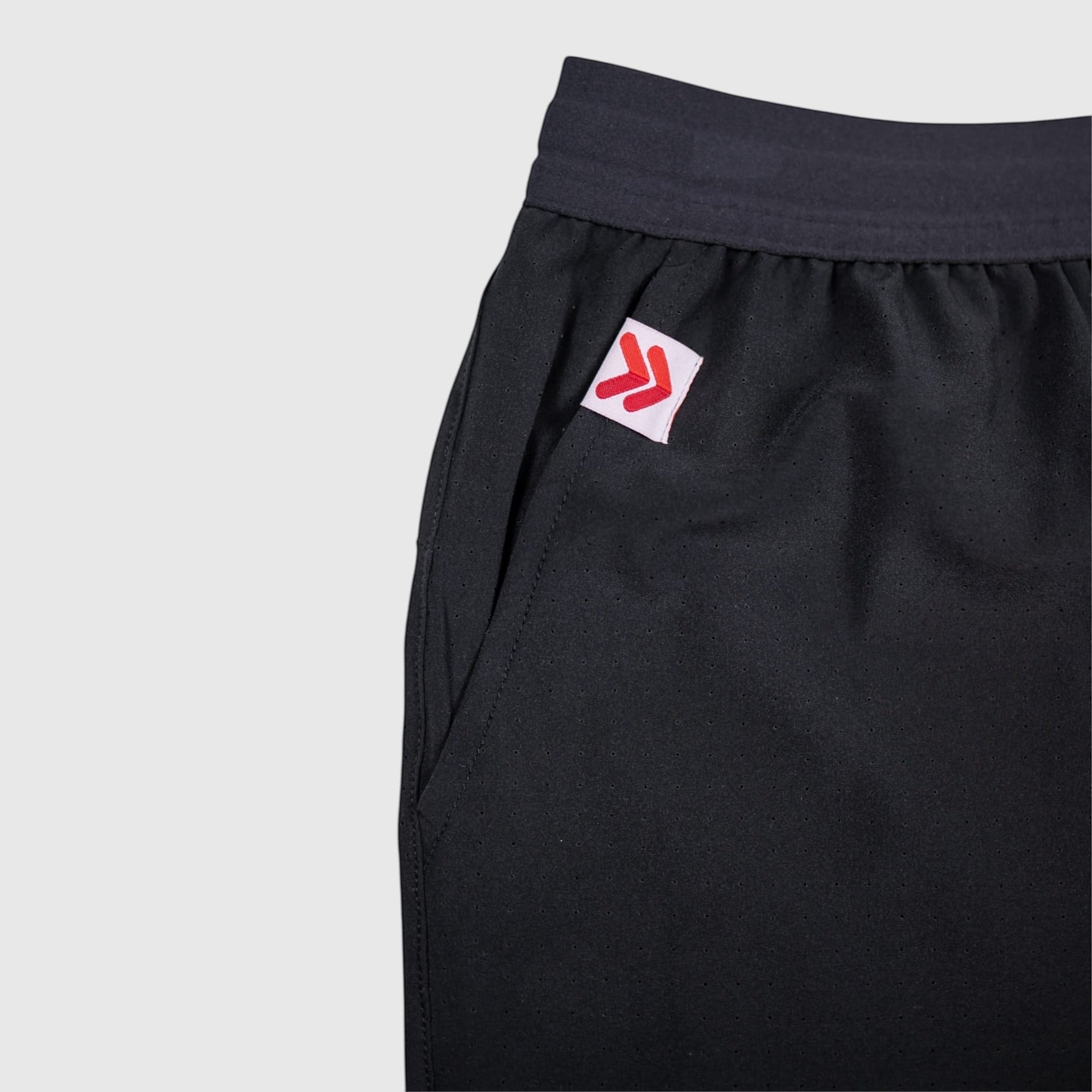 MOVE sport apparel black Agility 6 inch training shorts with perforated fabric and red logo patch detail