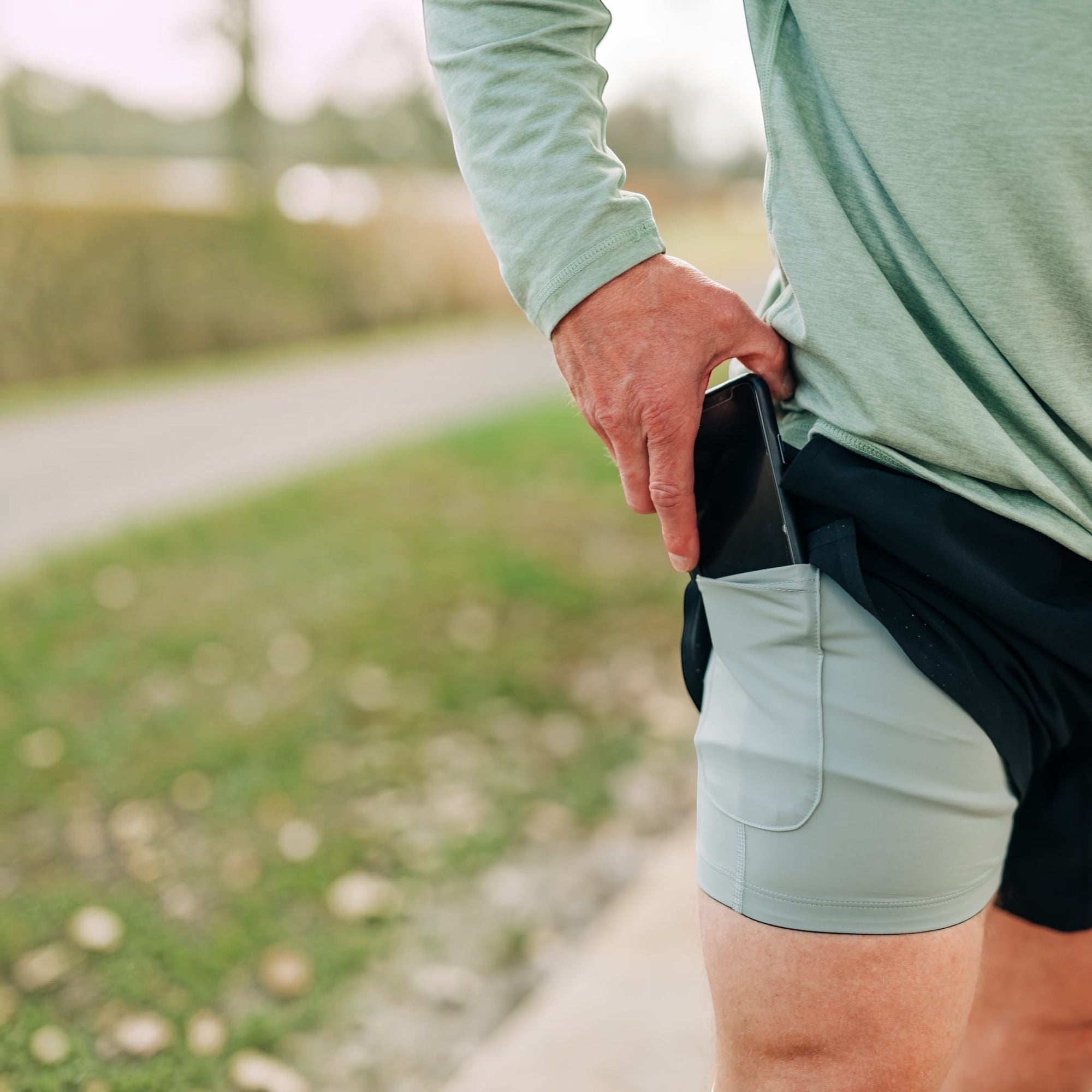 MOVE sport apparel Agility 6 inch training shorts in black with a light grey compression liner and phone pocket