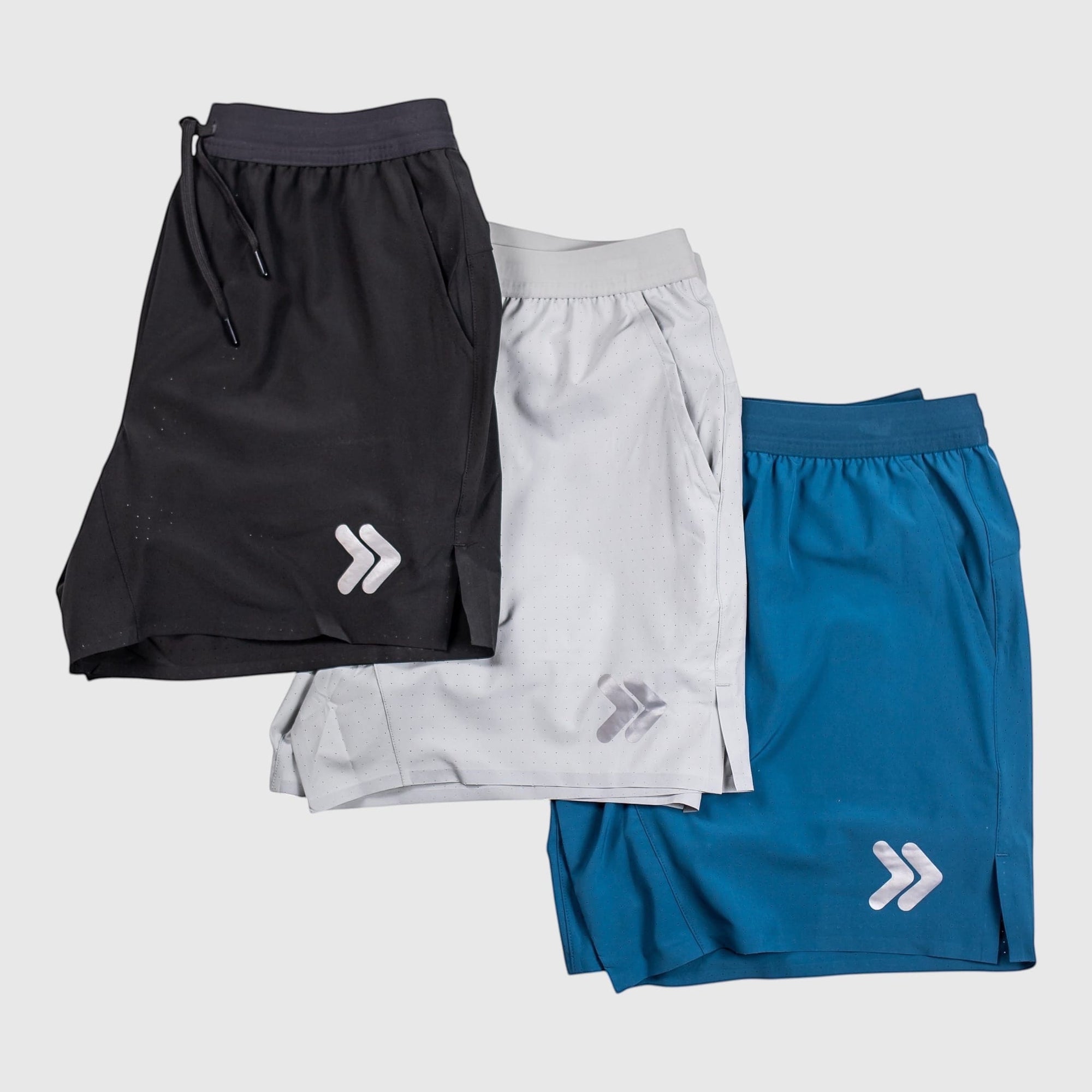 MOVE sport apparel Agility 6 inch training shorts in black, light grey, and blue with boxer brief liners.