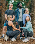 MOVE sport apparel group wearing athletic training gear and shorts in a forest setting