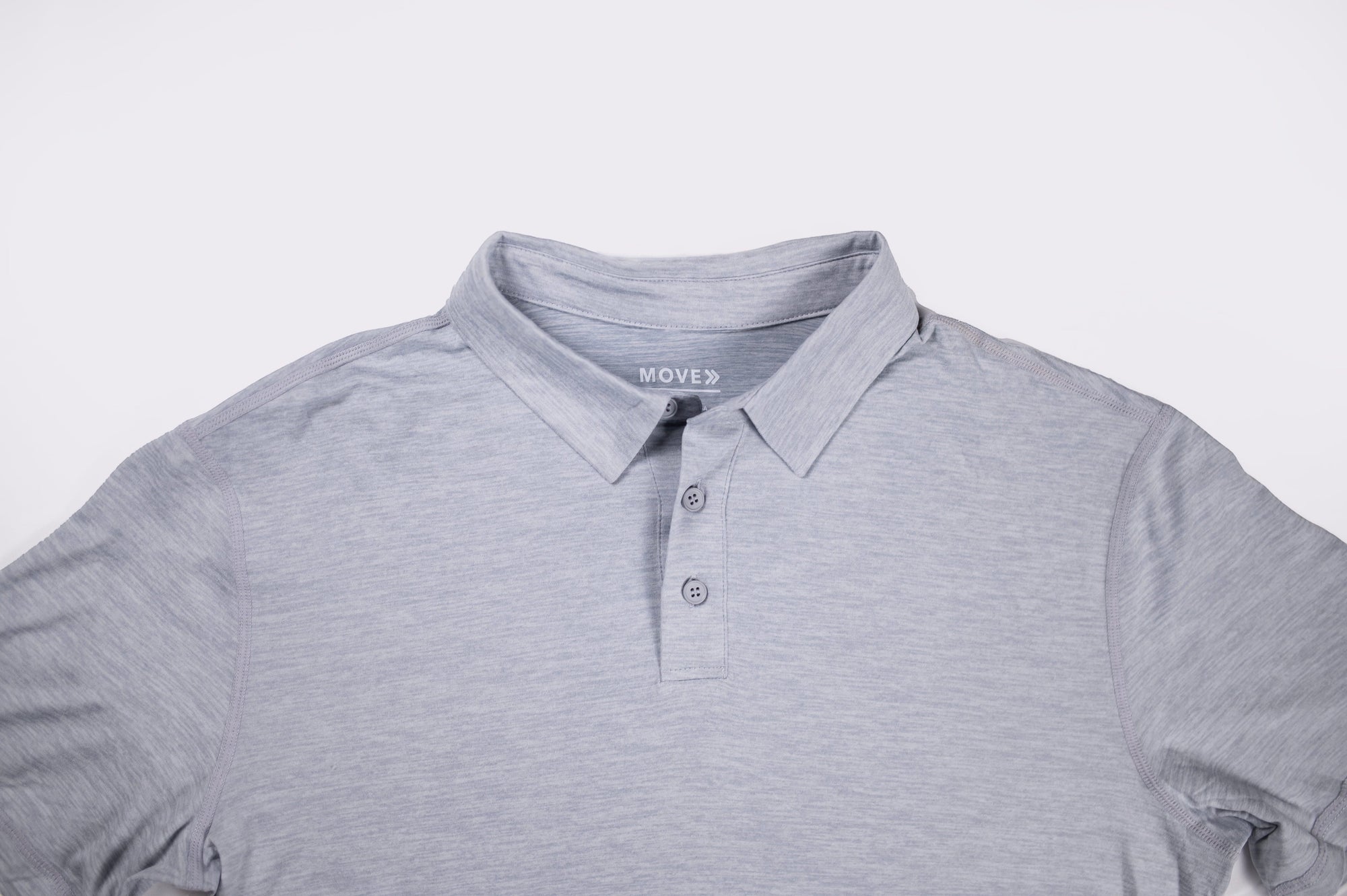 MOVE sport apparel Essential Polo Shirt in light grey moisture-wicking fabric with a classic collar and button placket