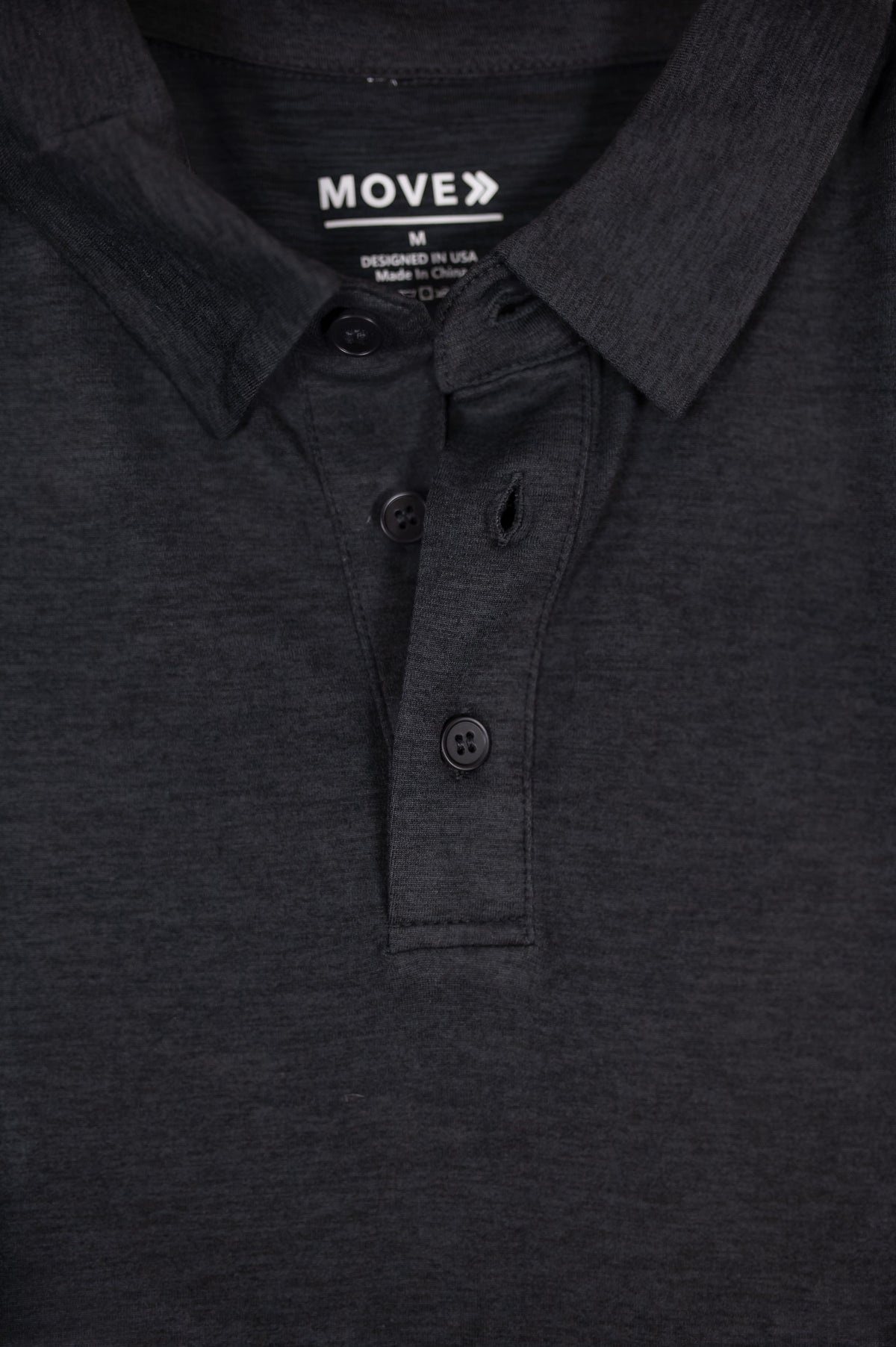MOVE sport apparel Essential Polo Shirt in charcoal grey moisture-wicking fabric with a classic button placket