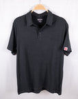 MOVE sport apparel Essential Polo Shirt in charcoal grey moisture-wicking fabric with a classic collar and logo patch