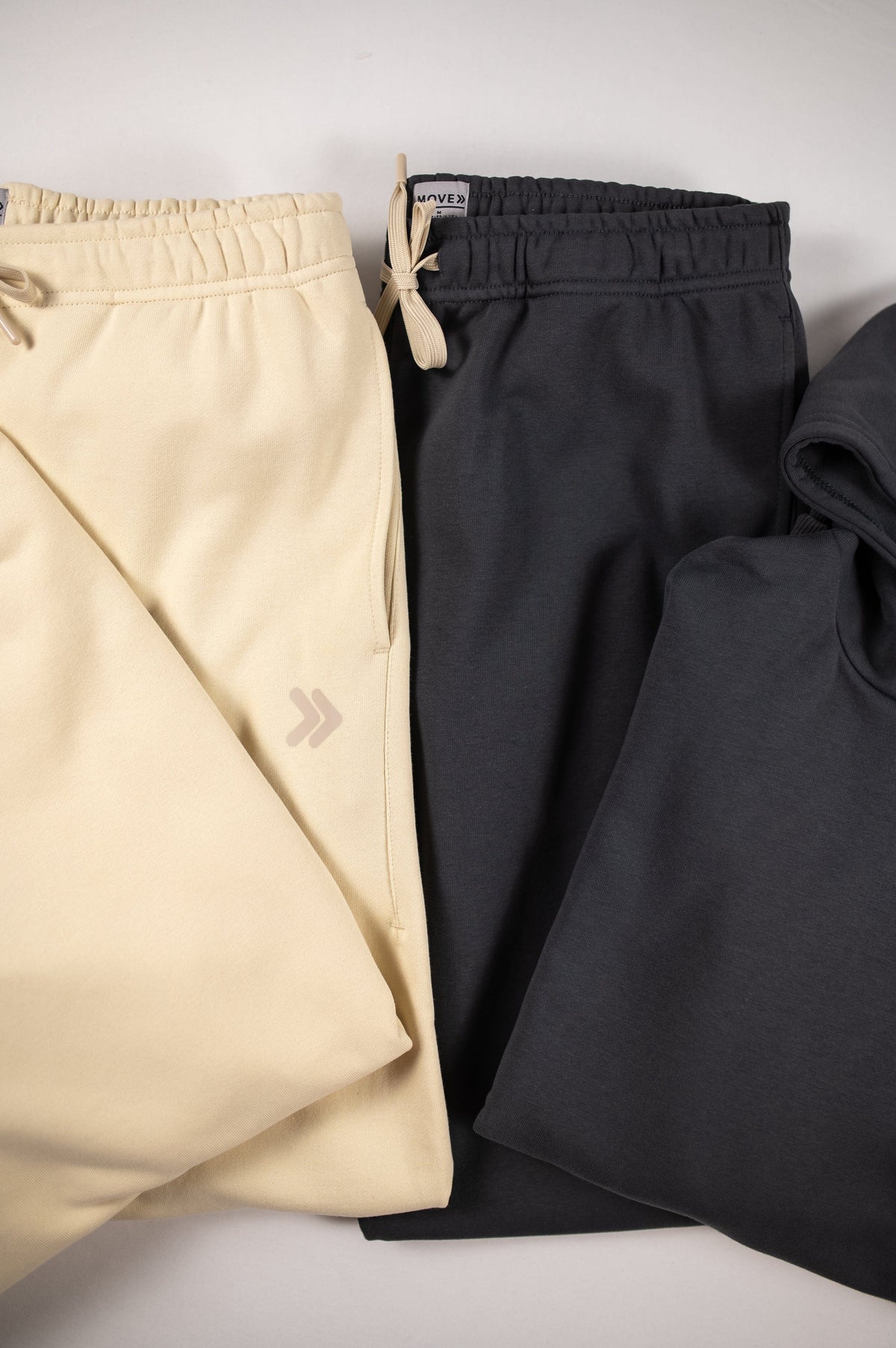 MOVE sport apparel French Terry Joggers in cream and charcoal grey with adjustable drawstring waist and side pockets