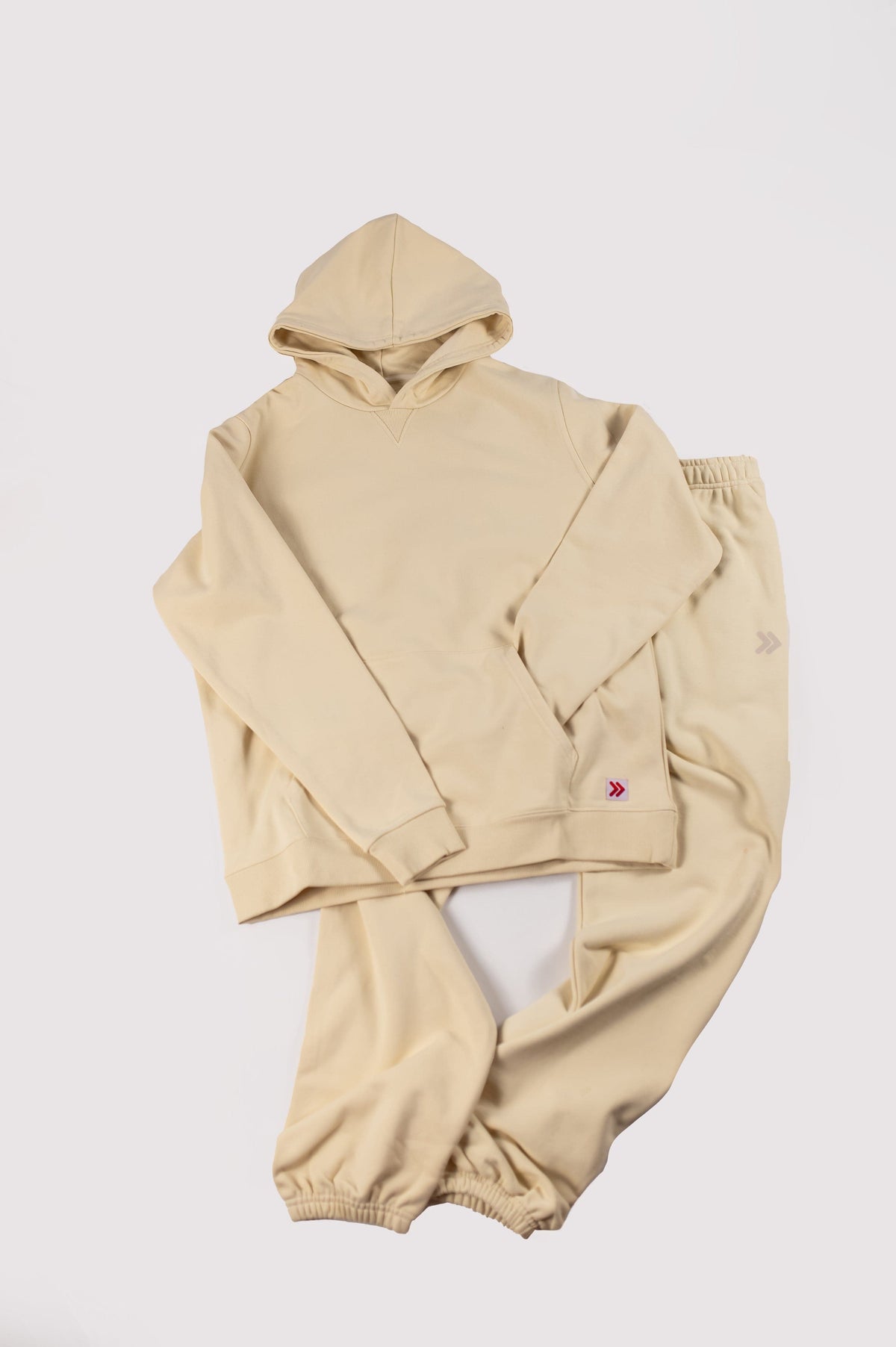 MOVE sport apparel beige French terry hoodie and matching joggers set with ribbed cuffs and minimalist branding