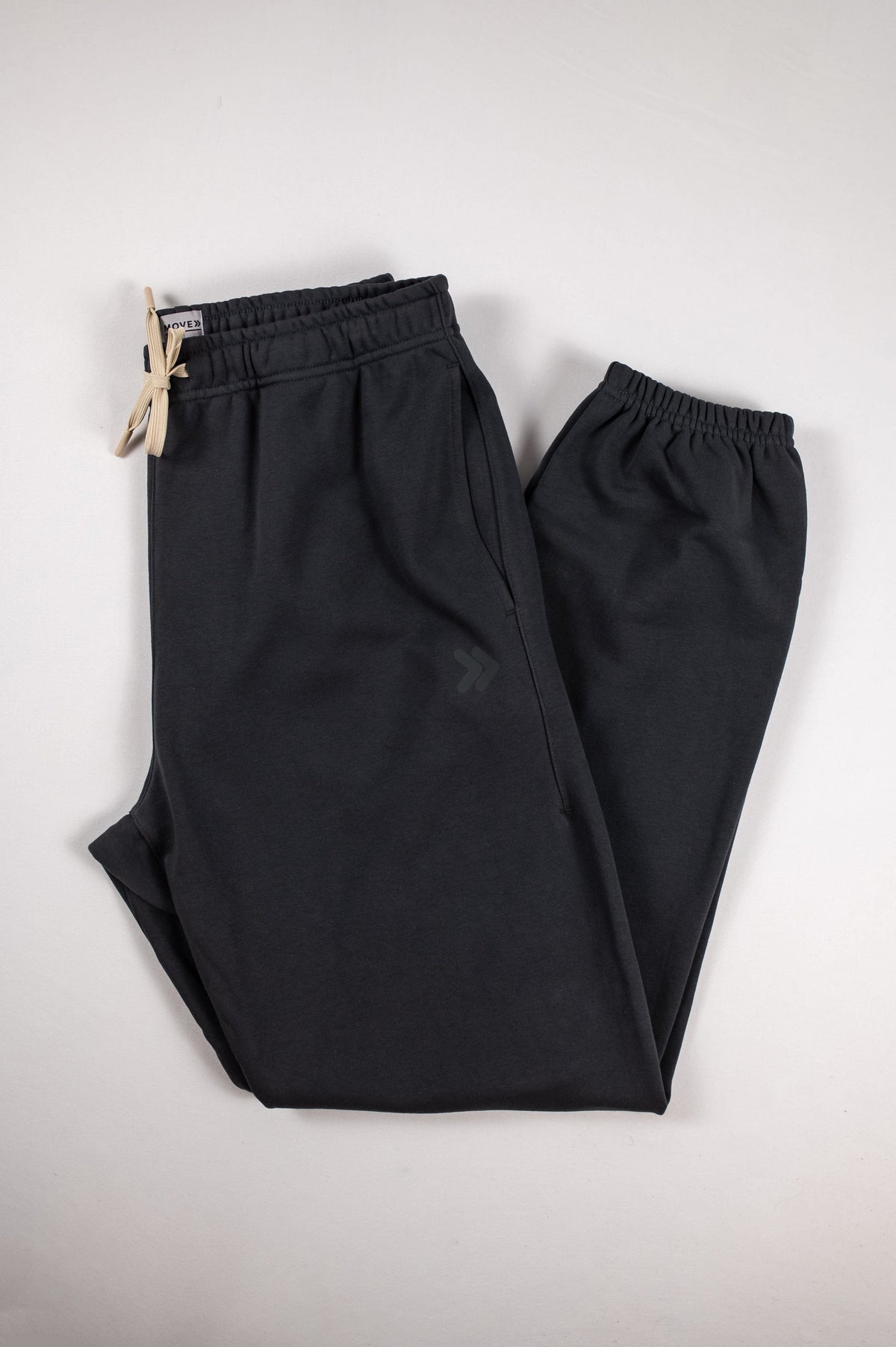 MOVE sport apparel black French terry joggers with an elastic drawstring waistband and ribbed ankle cuffs.
