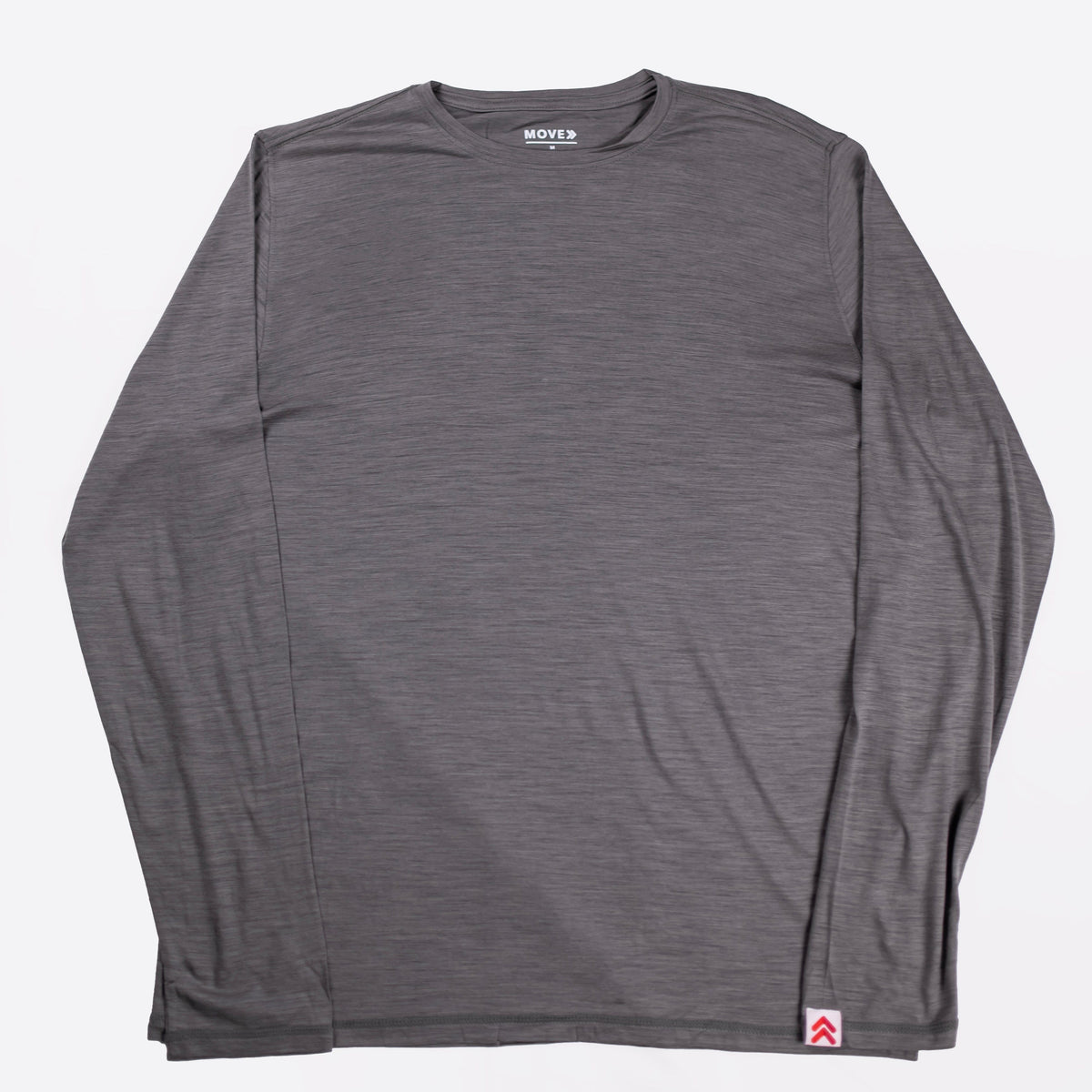 MOVE sport apparel men's heathered grey merino wool long sleeve crew neck shirt with a signature cuff brand tab.