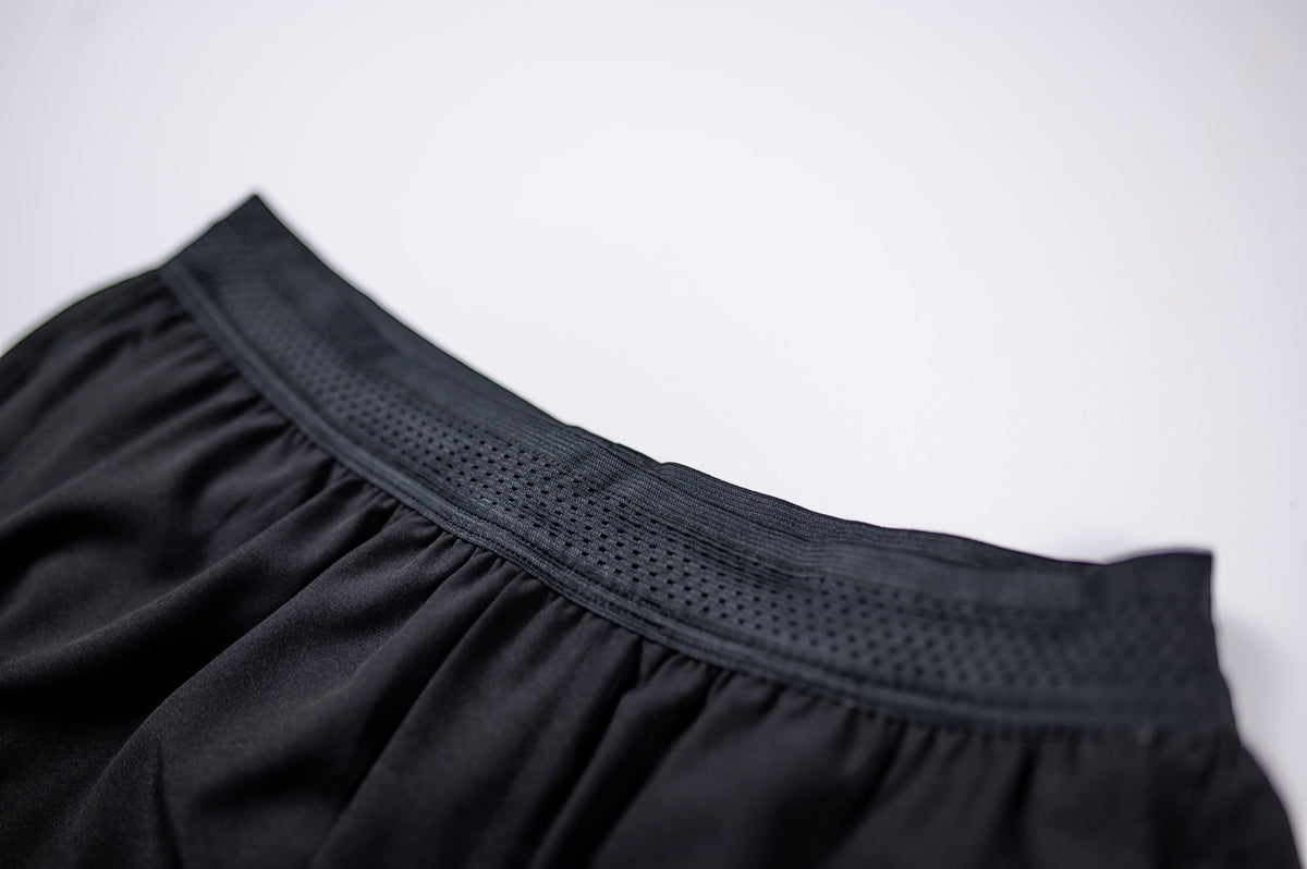 MOVE sport apparel men's black running shorts featuring a breathable perforated elastic waistband