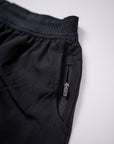 MOVE sport apparel men's black running shorts featuring a breathable waistband and a secure zippered side pocket.