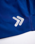 MOVE sport apparel men's royal blue running shorts featuring a reflective logo detail on the fabric.