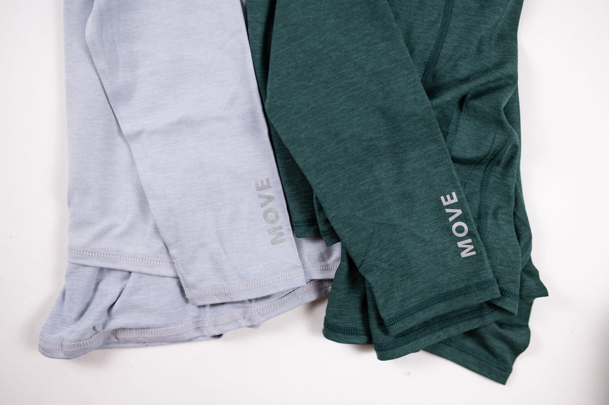 MOVE sport apparel women's essential quarter zip tops in light grey and dark green with reflective logo details