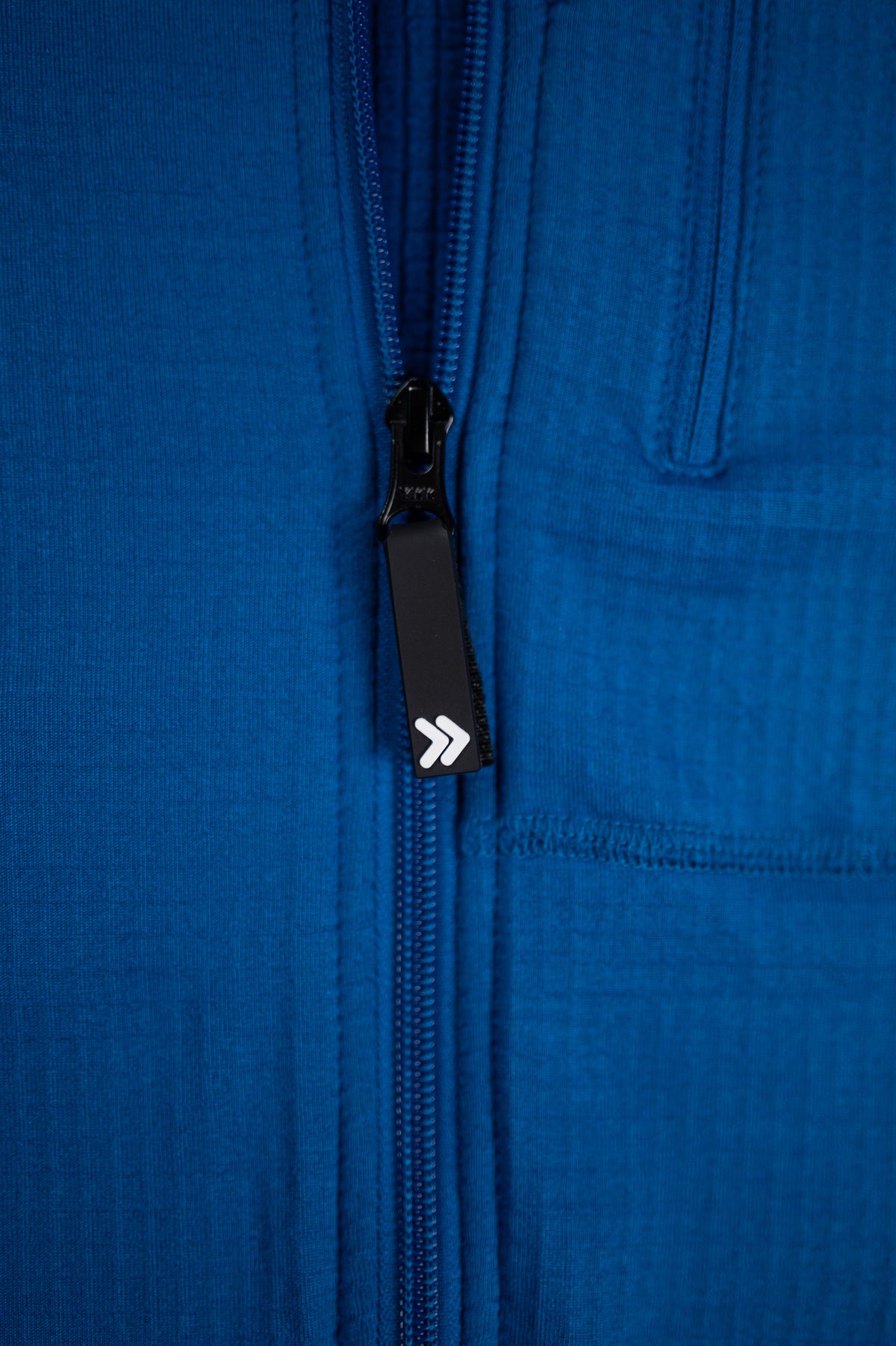 MOVE sport apparel blue waffle-knit full zip hoodie featuring a black zipper pull with a white double arrow logo