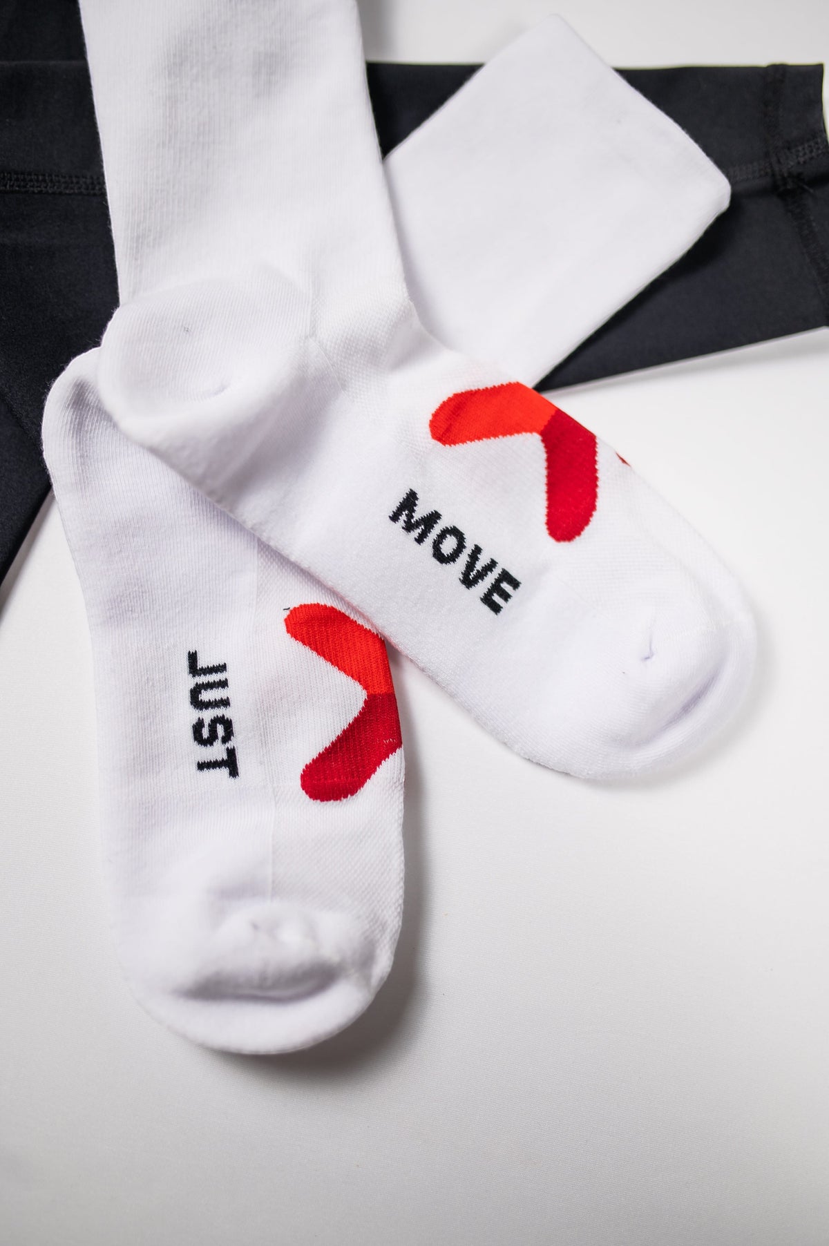 Original white MOVE Sport Apparel Performance Crew Socks with red embellishments and black JUST MOVE lettering.