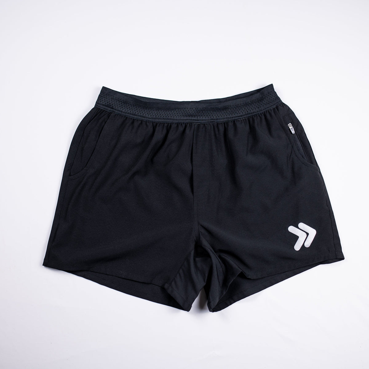 MOVE Sport Apparel men’s Performance 5 Inch Running Shorts: Black shorts front flat lay with original white double-chevron.