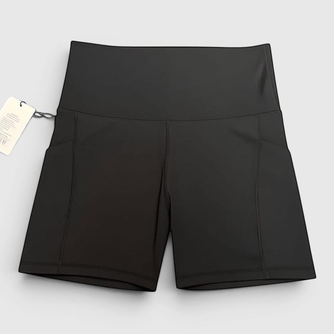 MOVE sport apparel black high-rise athletic performance shorts with side pockets and moisture-wicking fabric.