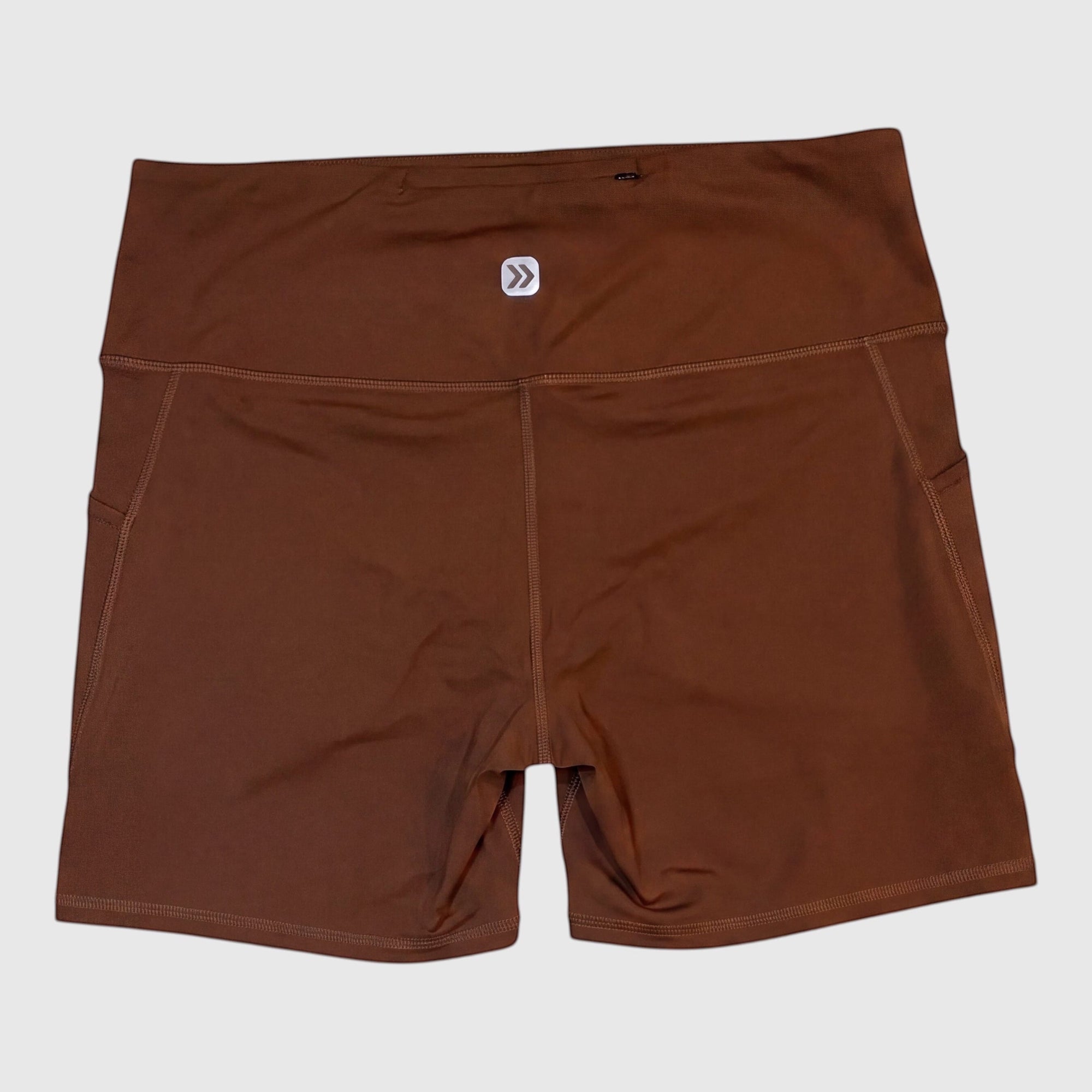 MOVE sport apparel women's brown high-rise athletic shorts with side pockets and moisture-wicking fabric