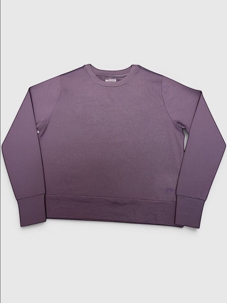 MOVE sport apparel women's long sleeve crewneck pullover in a muted purple with extended cuffs and relaxed fit.