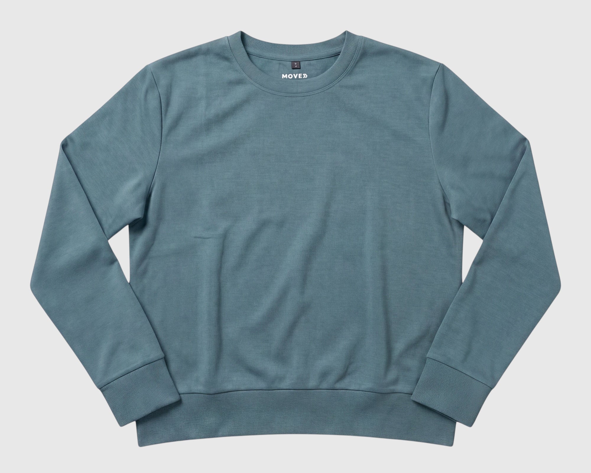MOVE sport apparel women's long sleeve crewneck pullover in a wasabi hue with ribbed cuffs and hem.