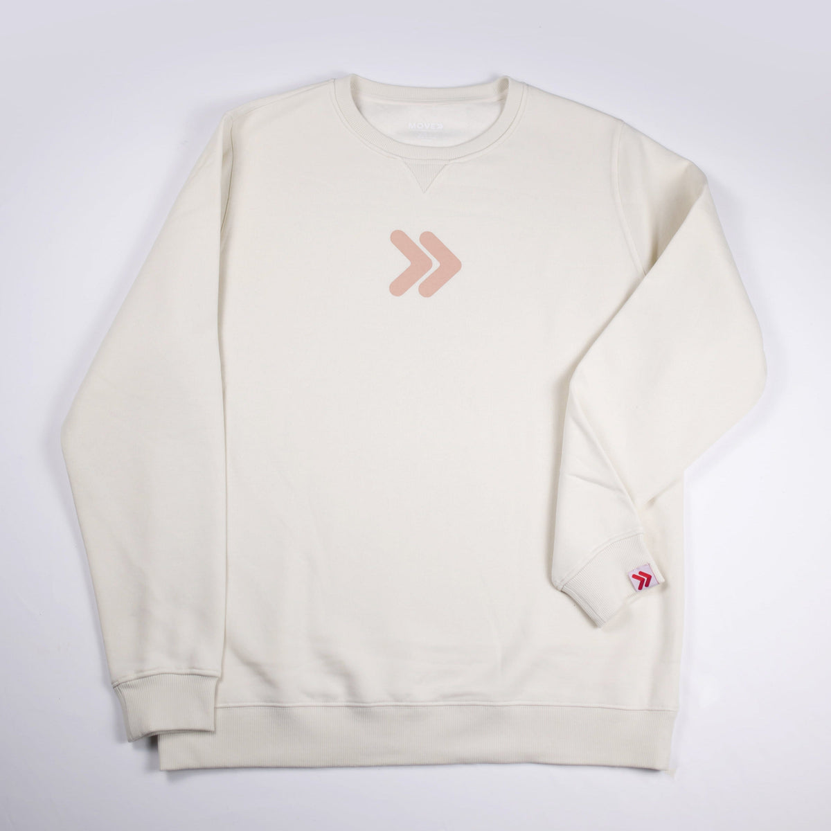 Cream MOVE Sport Apparel Logo Sweatshirt front view with blush-pink double-chevron centered on the chest and original red-and-white sleeve cuff tab.