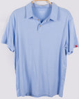 MOVE sport apparel light blue moisture-wicking polo shirt with a classic collar and button placket on a hanger