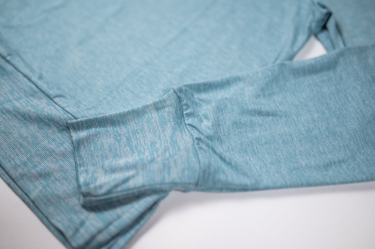 MOVE sport apparel heathered blue long sleeve crewneck sweatshirt with ribbed cuffs and soft-touch fabric