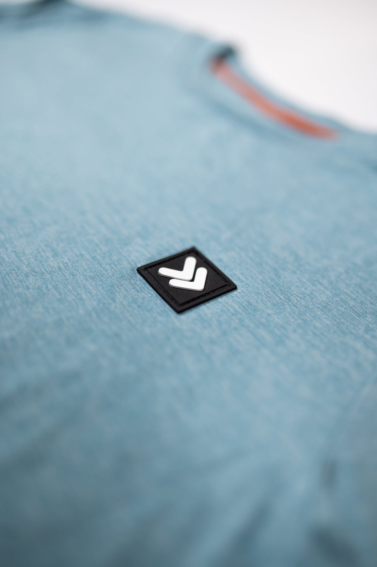 MOVE sport apparel heathered blue long sleeve crewneck sweatshirt with signature Black Label patch detail