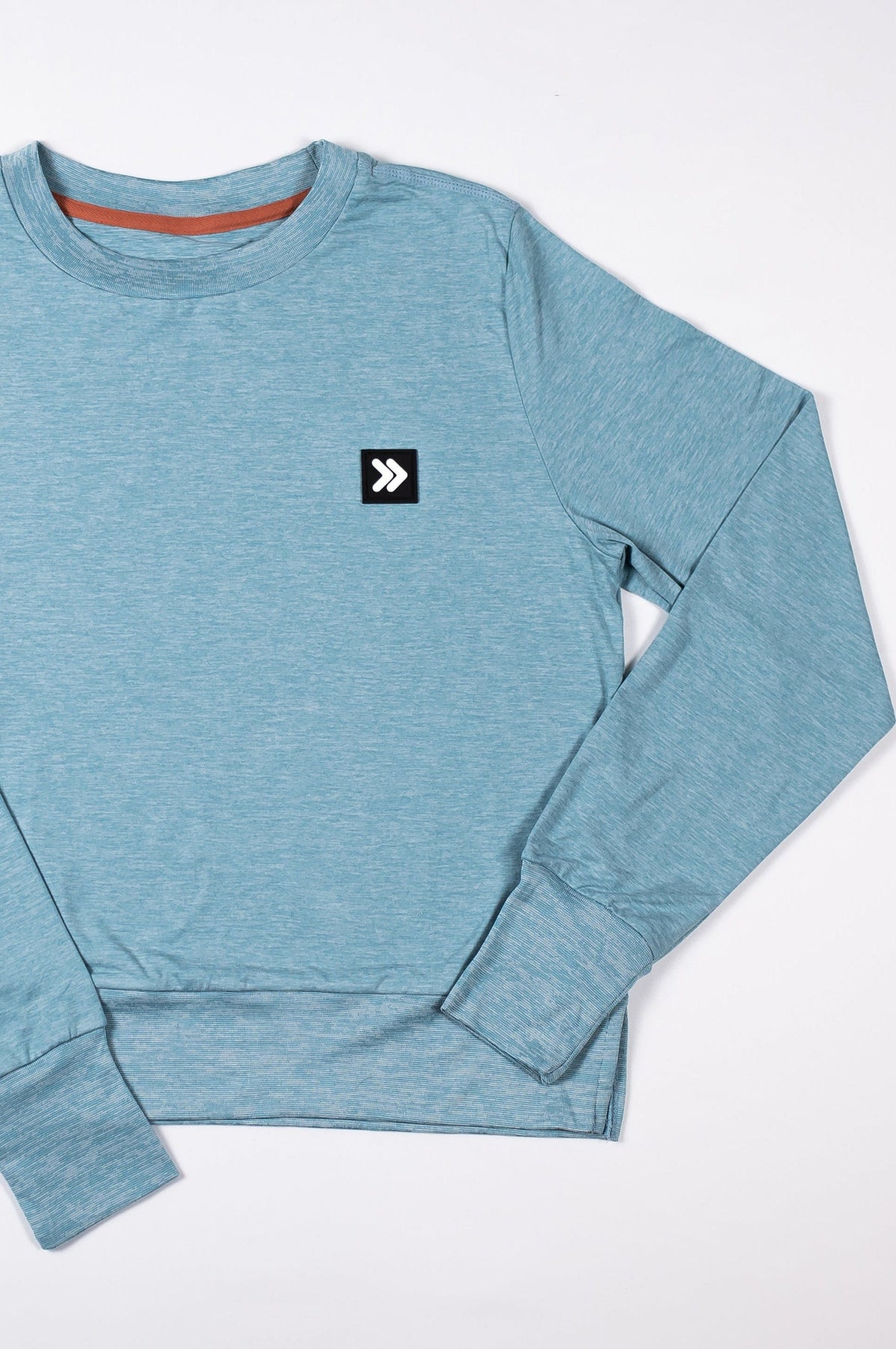 MOVE sport apparel blue heathered long sleeve crewneck sweatshirt with ribbed cuffs and signature brand patch