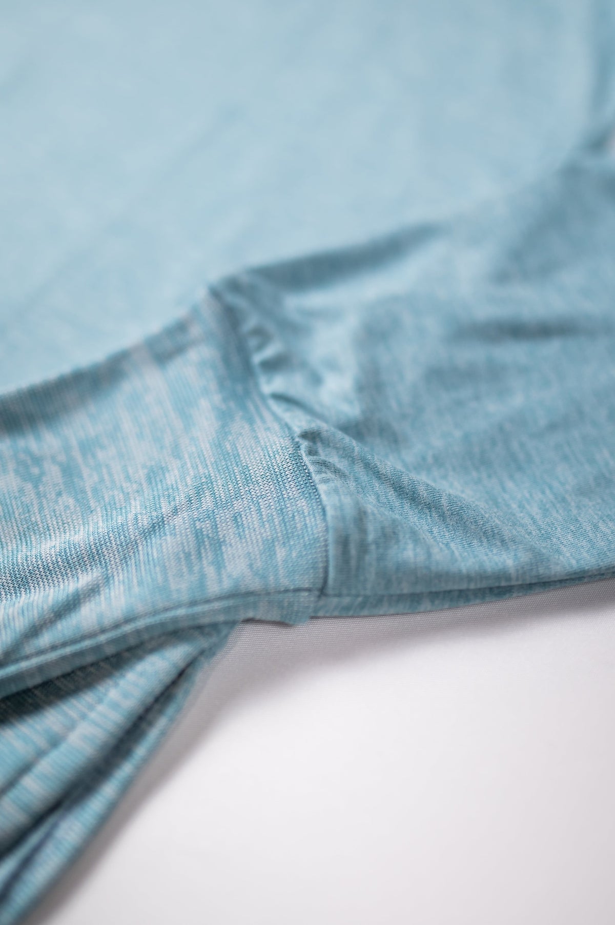 MOVE sport apparel heathered blue long sleeve crewneck sweatshirt showing soft fabric texture and ribbed cuff detail