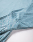 MOVE sport apparel heathered blue long sleeve crewneck sweatshirt showing soft fabric texture and ribbed cuff detail