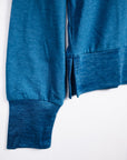 MOVE sport apparel blue heathered long sleeve crewneck sweatshirt featuring ribbed cuffs and a side-slit hem detail.