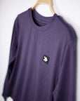 MOVE sport apparel purple long sleeve crewneck sweatshirt with signature Black Label patch on a wooden hanger