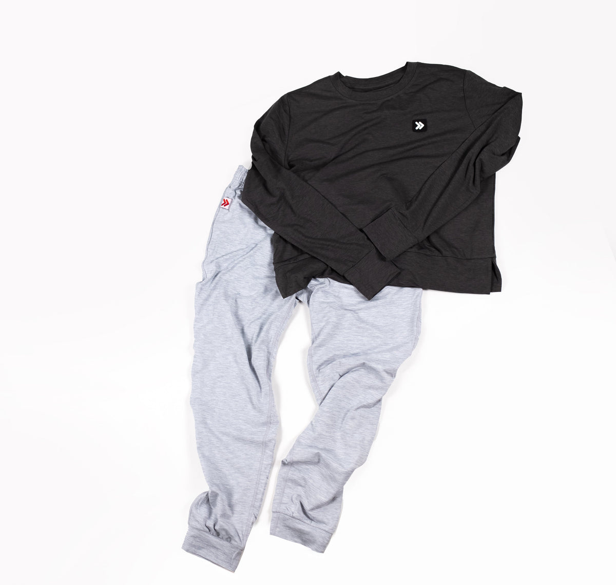 MOVE sport apparel charcoal crewneck sweatshirt and light grey joggers set with signature branding on white background