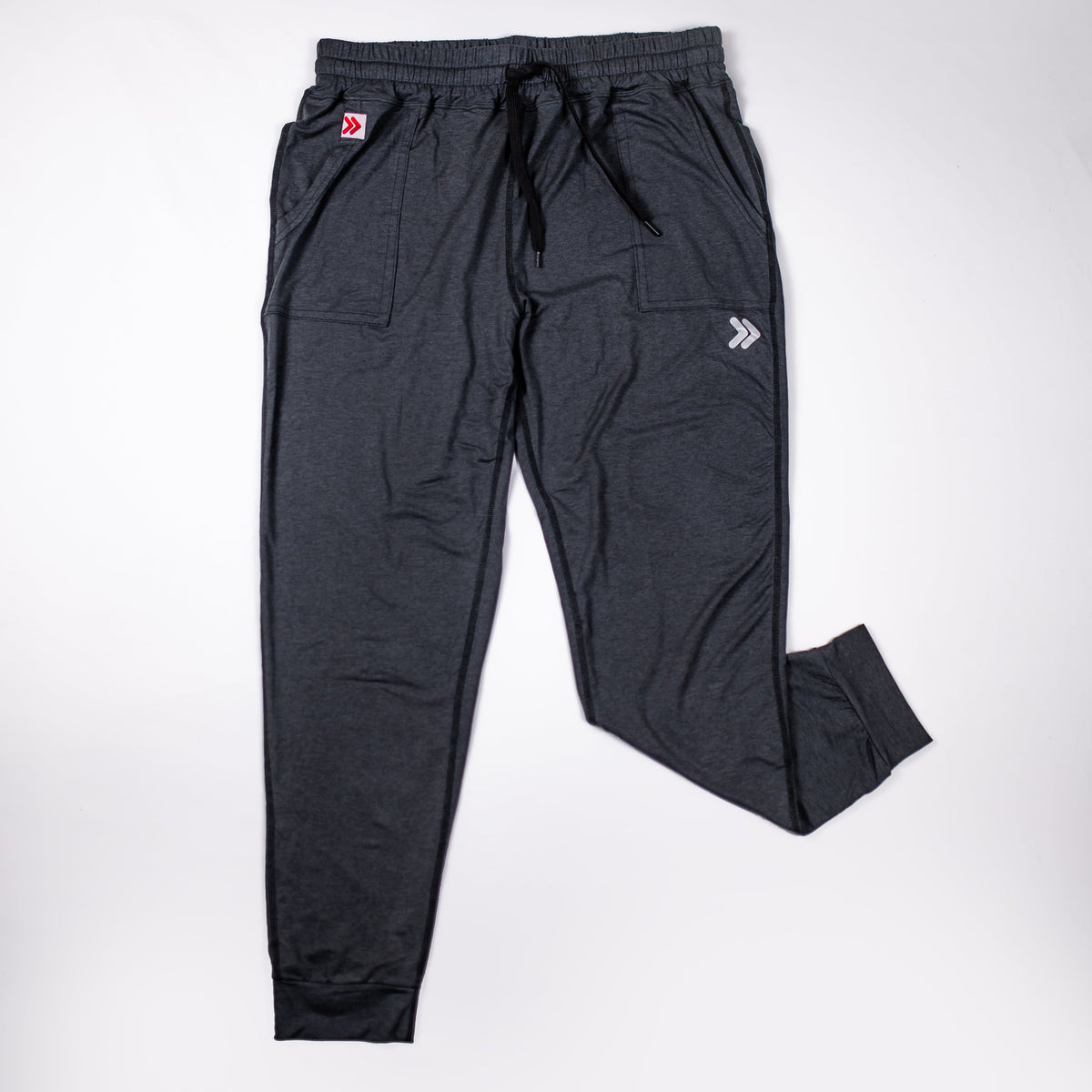Front view of MOVE Sport Apparel women’s Essential Joggers in Black with original pocket tab and thigh embellishment.