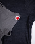 MOVE Sport Apparel women’s Merino Short Sleeve T-Shirt: Black and Granite Gray Merino shirts shown with original red-and-white sleeve tabs.