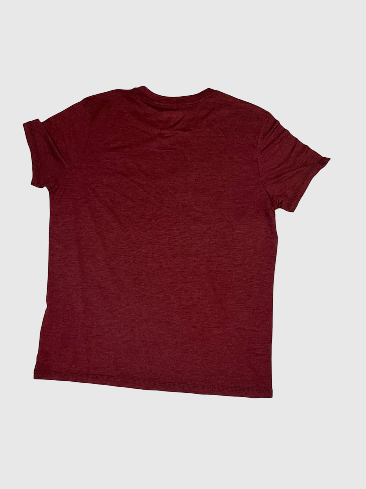 MOVE Sport Apparel women’s Merino Short Sleeve T-Shirt: Rear flat-lay view of Oxblood Red Merino Short Sleeve T-Shirt.